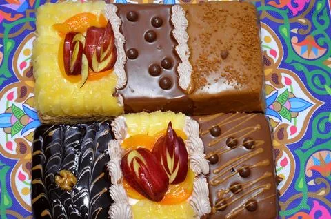 Rectangular shaped birthday cake of 3 parts of different pieces sponge crea.. Stock Photos