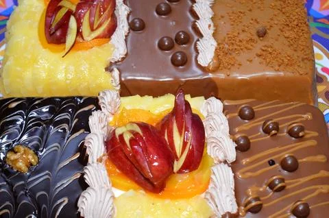 Rectangular shaped birthday cake of 3 parts of different pieces sponge crea.. Stock Photos