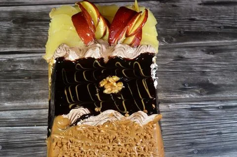 Rectangular shaped birthday cake of 3 parts of different pieces sponge crea.. Stock Photos