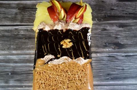 Rectangular shaped birthday cake of 3 parts of different pieces sponge crea.. Stock Photos