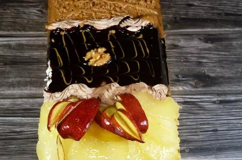 Rectangular shaped birthday cake of 3 parts of different pieces sponge crea.. Stock Photos
