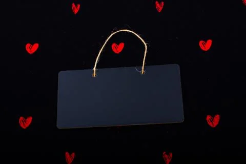 Rectangular shaped black notice board  and red hearts Stock Photos