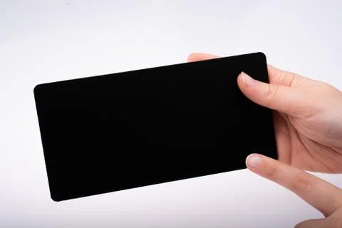 Rectangular shaped black notice board in hand Stock Photos
