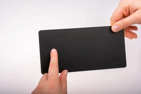 Rectangular shaped black notice board in hand Stock Photos
