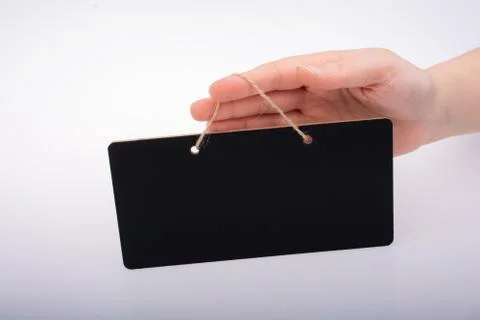 Rectangular shaped black notice board in hand Stock Photos