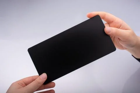 Rectangular shaped black notice board in hand 写真素材