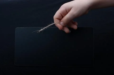 Rectangular shaped black notice board in hand Stock Photos