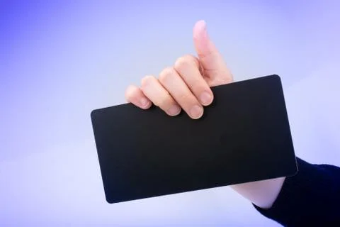 Rectangular shaped black notice board in hand 写真素材