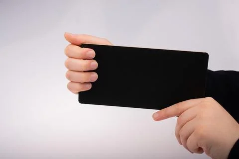Rectangular shaped black notice board in hand Stock Photos