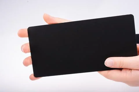 Rectangular shaped black notice board in hand Stock Photos