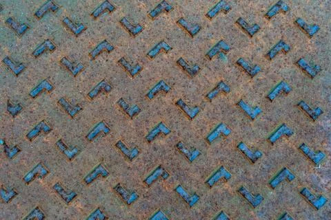 Rectangular shapes on rusted metal surface with patterns and cracks Stock Photos