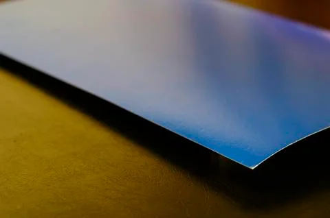 Rectangular sheet of blue paper on a black background. Stock Photos