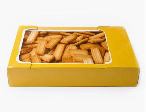 Rectangular shortbread cookies filling a yellow cardboard box Foto stock