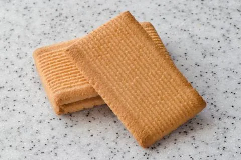 Rectangular shortbread cookies on a light marble top. Homemade baking. Stock Photos