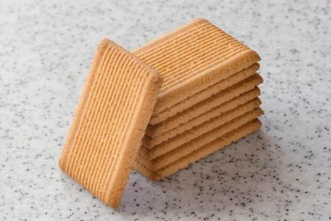 Rectangular shortbread cookies on a light marble top. Homemade baking. Stock Photos