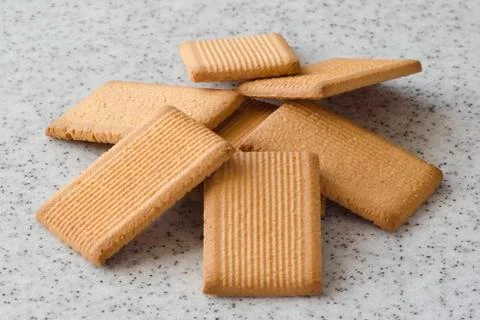 Rectangular shortbread cookies on a light marble top. Homemade baking. Stock Photos
