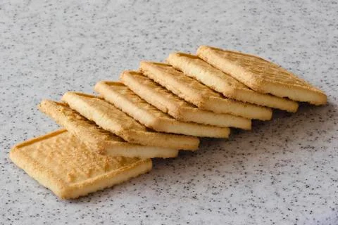Rectangular shortbread cookies on a light marble top. Homemade baking. Stock Photos