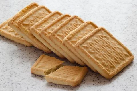 Rectangular shortbread cookies on a light marble top. Homemade baking. Stock Photos