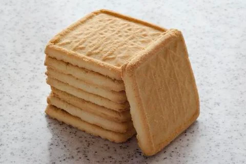 Rectangular shortbread cookies on a light marble top. Homemade baking. Stock Photos