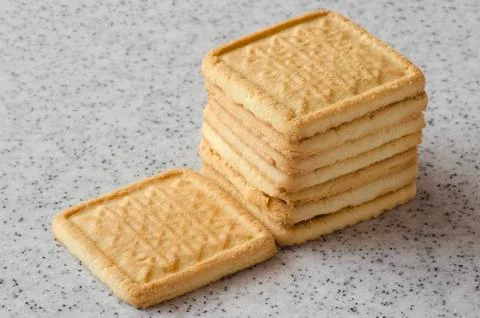 Rectangular shortbread cookies on a light marble top. Homemade baking. Stock Photos
