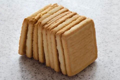 Rectangular shortbread cookies on a light marble top. Homemade baking. Stock Photos