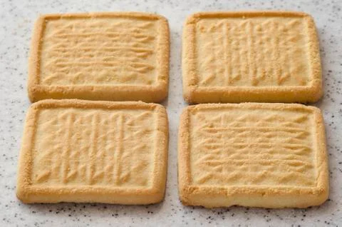 Rectangular shortbread cookies on a light marble top. Homemade baking. Stock Photos
