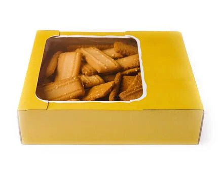 Rectangular shortbread cookies with sesame seeds in yellow cardboard box Stock Photos