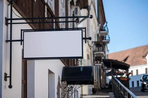 Rectangular signboard template on a old south street. Illustrazione stock