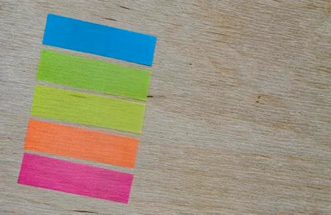 Rectangular stickers for notes on a textured wooden background Stock Photos
