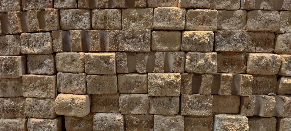 Rectangular stone bricks with rough, textured surfaces Stock Photos