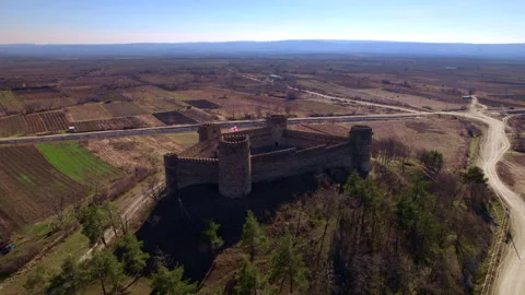 Rectangular Stone Fortress Above Rural Fields and Roads in Georgia Stock Footage 348380908