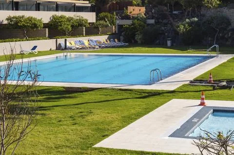 A rectangular swimming pool and another smaller one in a garden of the island of 스톡 사진