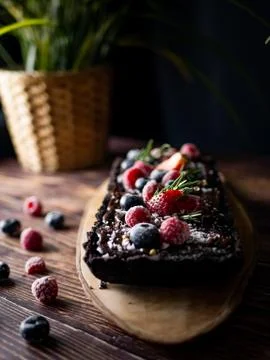 Rectangular Tart Chocolate cheesecake with fresh berries. delicious dessert f 스톡 사진
