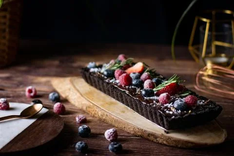Rectangular Tart Chocolate cheesecake with fresh berries. delicious dessert f Stock Photos