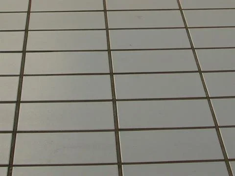 Rectangular tile floor with dark grout in perspective Stock Photos