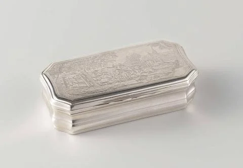 . Rectangular tobacco box with beveled corners and a hinged lid. On the li... Stock Photos