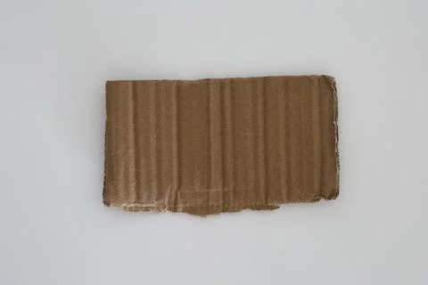 Rectangular torn cardboard piece isolated minimal composition 写真素材