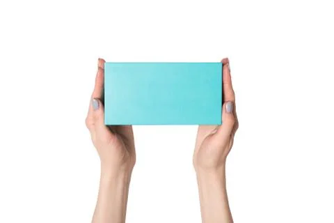 Rectangular turquoise box in female hands. Top view. Isolate Stock Photos