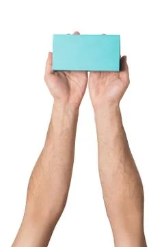 Rectangular turquoise box in male hands. Top view. Isolate 스톡 사진