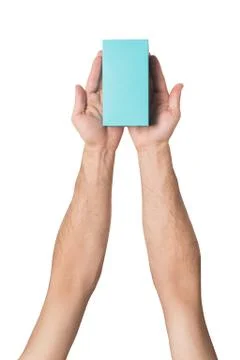 Rectangular turquoise box in male hands. Top view. Isolate 스톡 사진