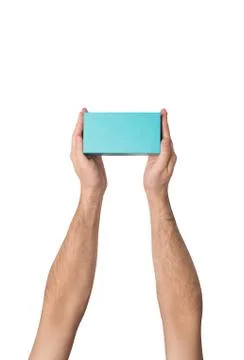 Rectangular turquoise box in male hands. Top view. Isolate Stock Photos
