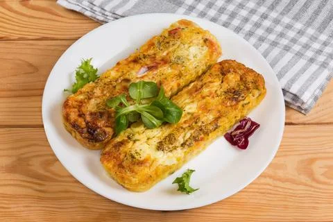 Rectangular vegetable casseroles with beaten eggs and cheese on dish Fotos de archivo