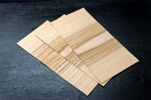 Rectangular Veneer Sheets on Black Background 库存照片