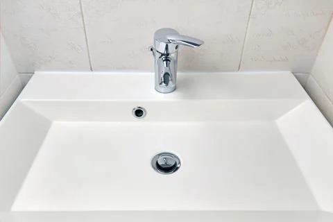 Rectangular washbasin in the bathroom after cleaning and disinfection. Cleaning Stock Photos
