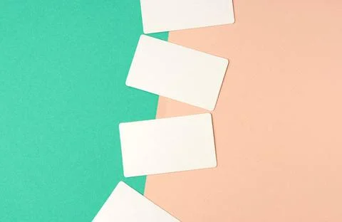 Rectangular white blank business cards on a color background rectangular w... Stockfoto's