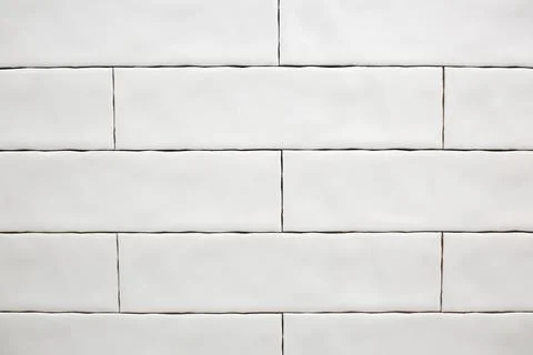 Rectangular white ceramic tile on the kitchen wall. Repairs in the kitchen Stock Photos