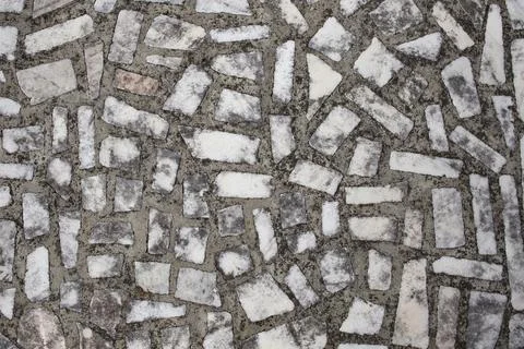 Rectangular white marble pieces on cement, aged mosaic structure backdrop Stock Photos