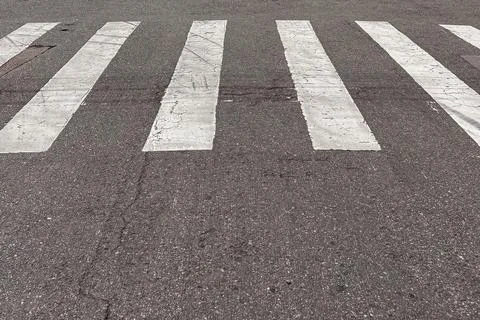 Rectangular white parallel crossings used in cities for pedestrian crossings. Stock Photos
