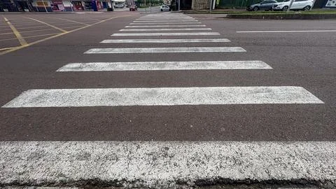 Rectangular white parallel crossings used in cities for pedestrian crossings. Stock Photos