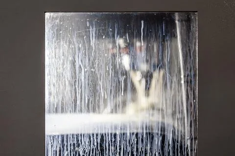 Rectangular window of abstract vertical milling machine covered with white 库存照片